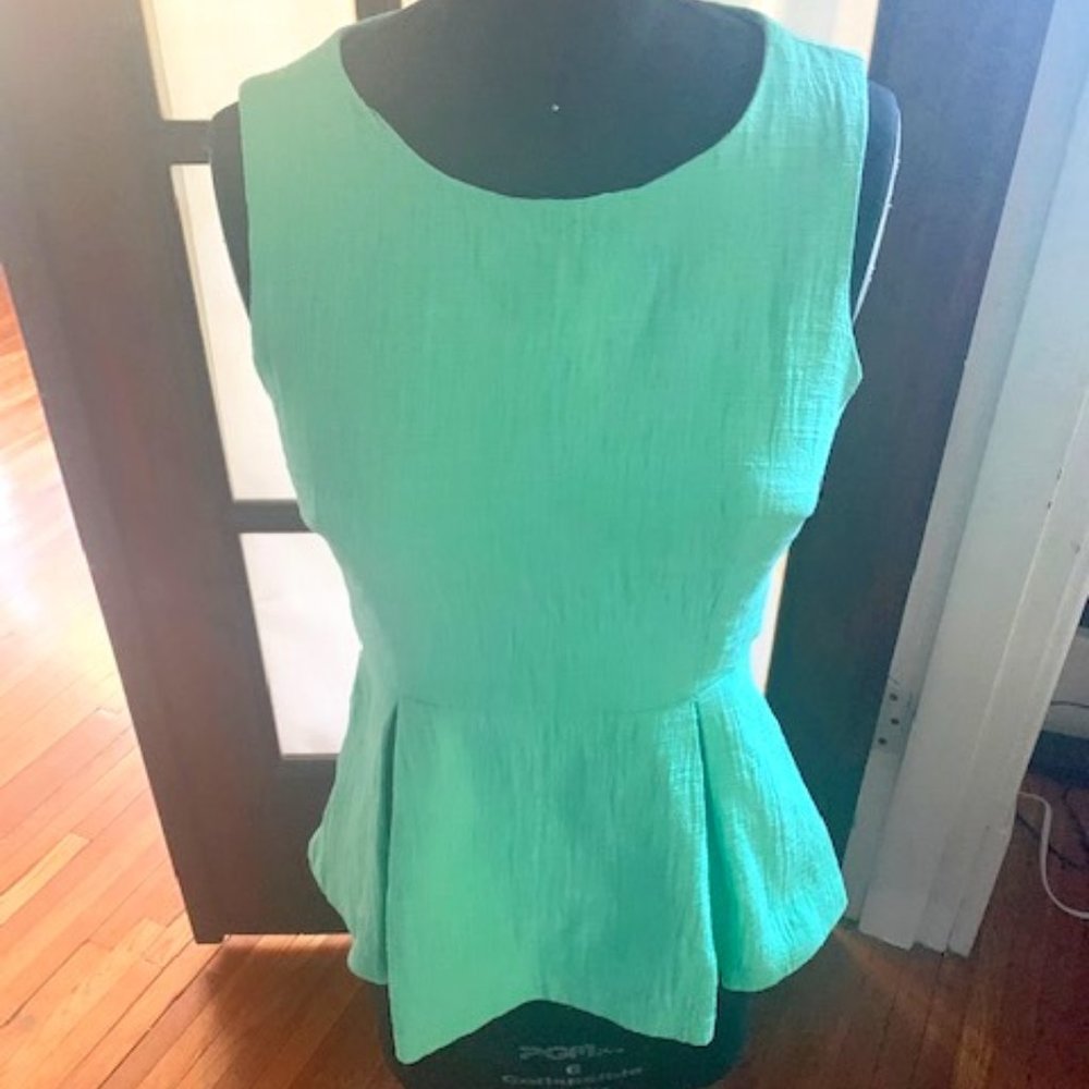 Mint green sleeveless peplum blouse